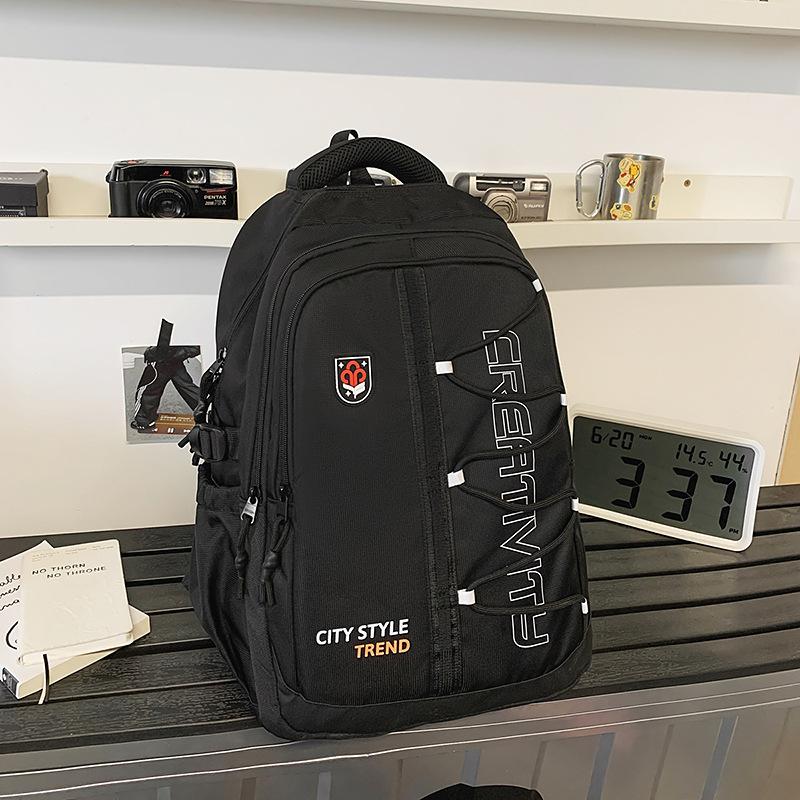 High-value retro tooling trendy and cool backpack for junior high school students, casual, simple, lightweight and large-capacity backpack.