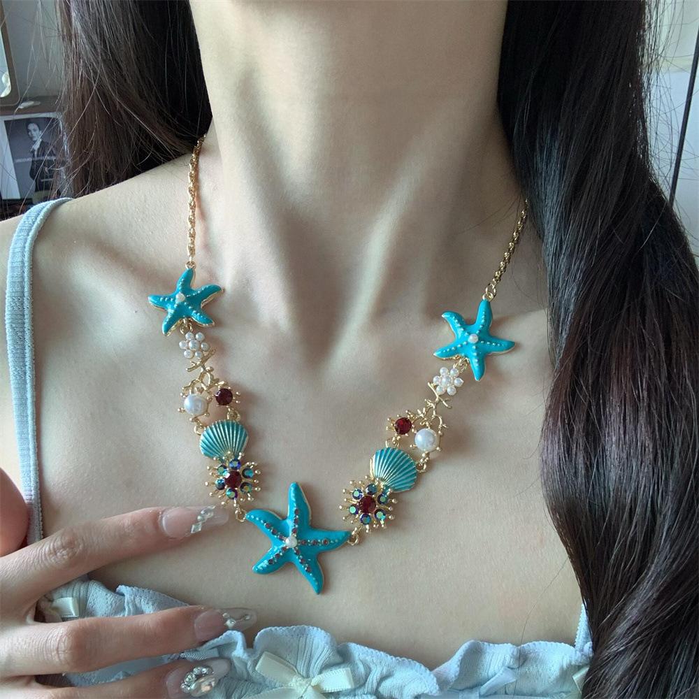 

Капающая жемчужина с бриллиантами, кулон в виде цветка морской звезды, ожерелье, стиль для отпуска на море, модный и универсальный темперамент, ожерелье высокого класса.