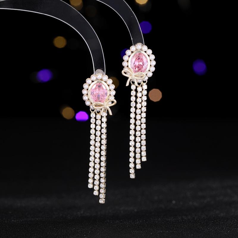 

Женские серьги с элегантным овальным бантом в стиле легкой роскоши, с кисточкой из искусственного жемчуга, модные и универсальные серьги нишевого дизайна