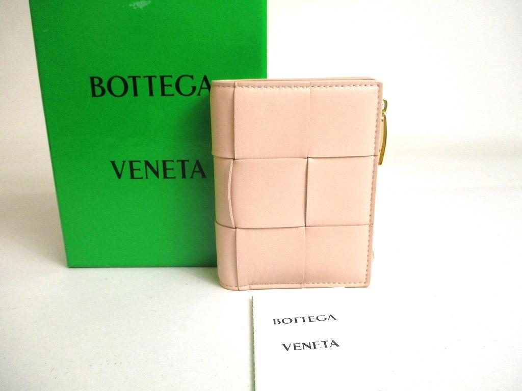 

Автентичний світло-рожевий шкіряний гаманець BOTTEGA VENETA на двоскладній блискавці №a416 відремонтований
