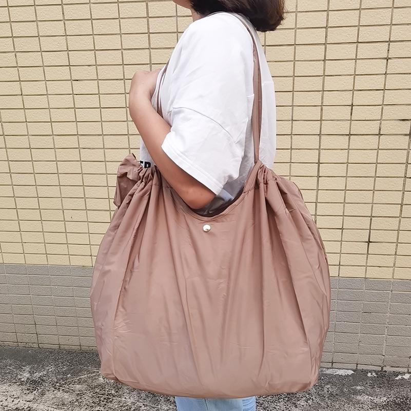 Eco-Friendly Foldable Shopping Tote with Buckle, Drawstring Closure, and Single Shoulder Strap