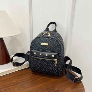 Schoolbag fashion PU travel small backpack storage Korean version lady temperament rivet small backpack trend small backpack