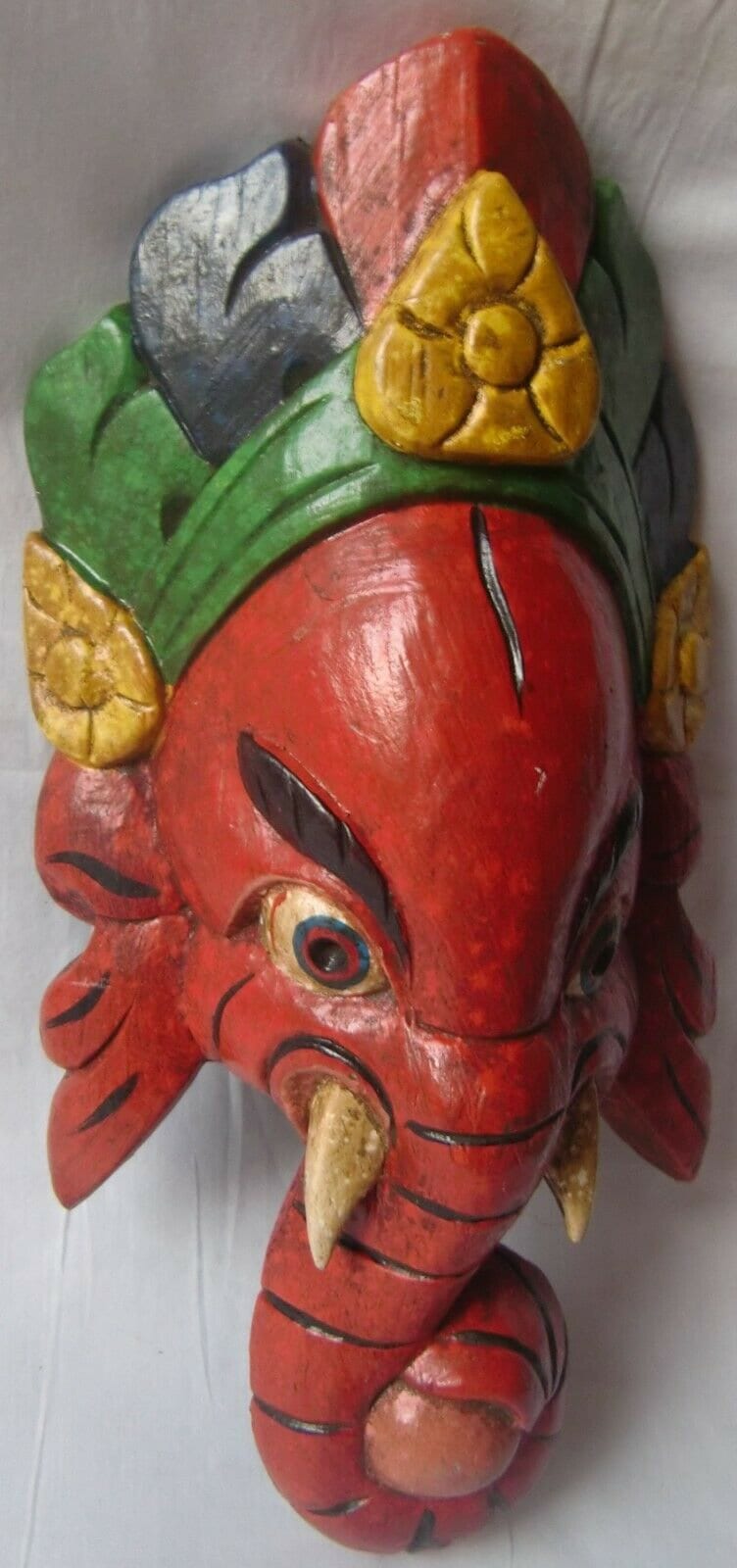 

Hand Painted Wooden Ganesha Mask: Indian Wall Decor 16” X 8” X 24” (l x w x h) різнокольоровий