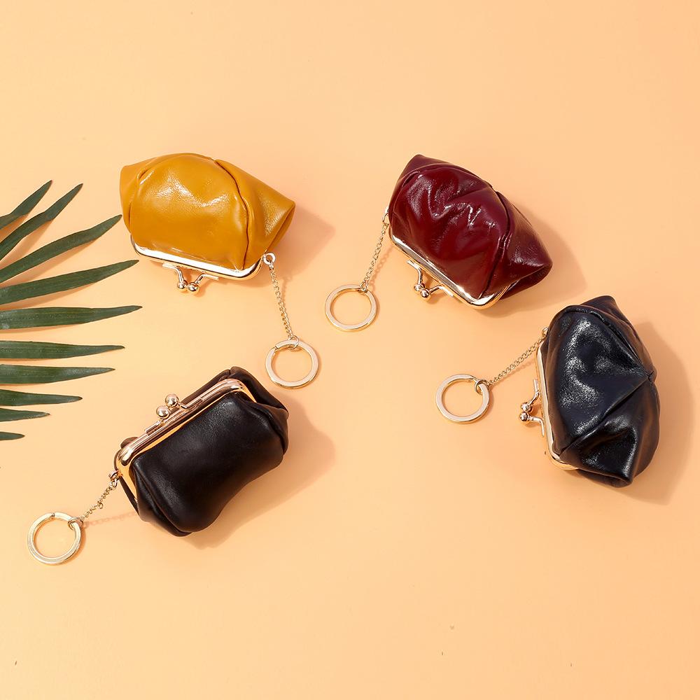 Retro clip change bag women's European and American, first layer oil wax cowhide Ins small earphones coin bag storage bag
