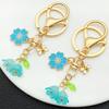 KC Gold Blue Cherry Blossom & Lily of the Valley Bee Keychain: 8-Shaped Backpack Ornament Pendant Gift