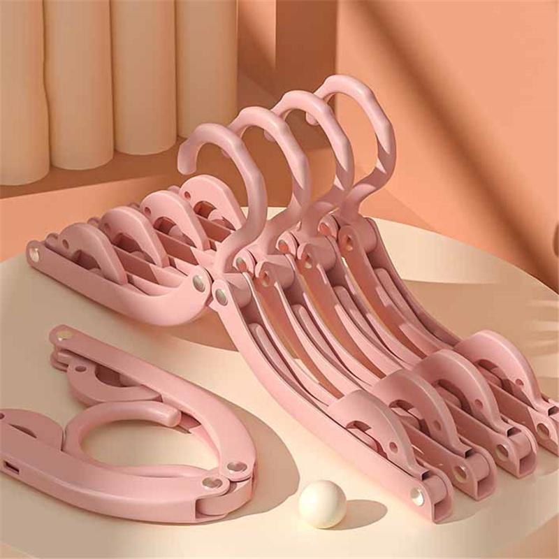 Портативная складная вешалка для пальто Business Trip Magic Solid Color Nonslip Multifunction Mini Drying Rack 1PC розовый