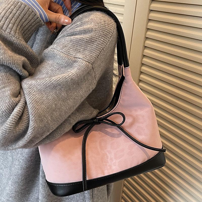 Korean version of niche foreign style portable bucket bag women's 2025 autumn new high-value suede bow shoulder bag