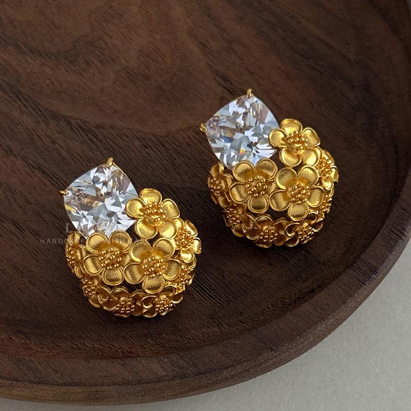 Gold and silver series zircon stud earrings two-color gold and silver hollow relief earrings light luxury cold shining versatile ears