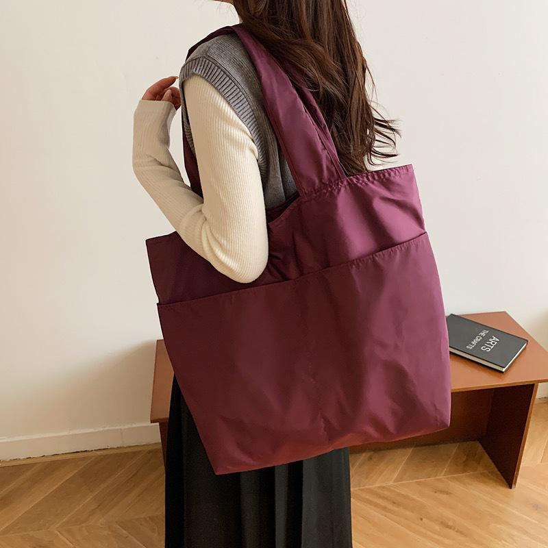 European-American Fashion Large Capacity Travel Bag - Solid Color, Nylon, Handheld or Shoulder Style for Women