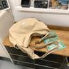 Hua'er and Xiao have the same casual trendy brand dumpling bag, women's sports cycling messenger bag, and boys' large-capacity shoulder bag.