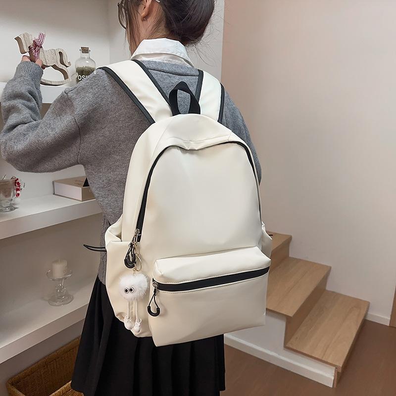 School bag solid color letter fashion backpack Korean version college student lightweight school bag outdoor travel large capacity backpack