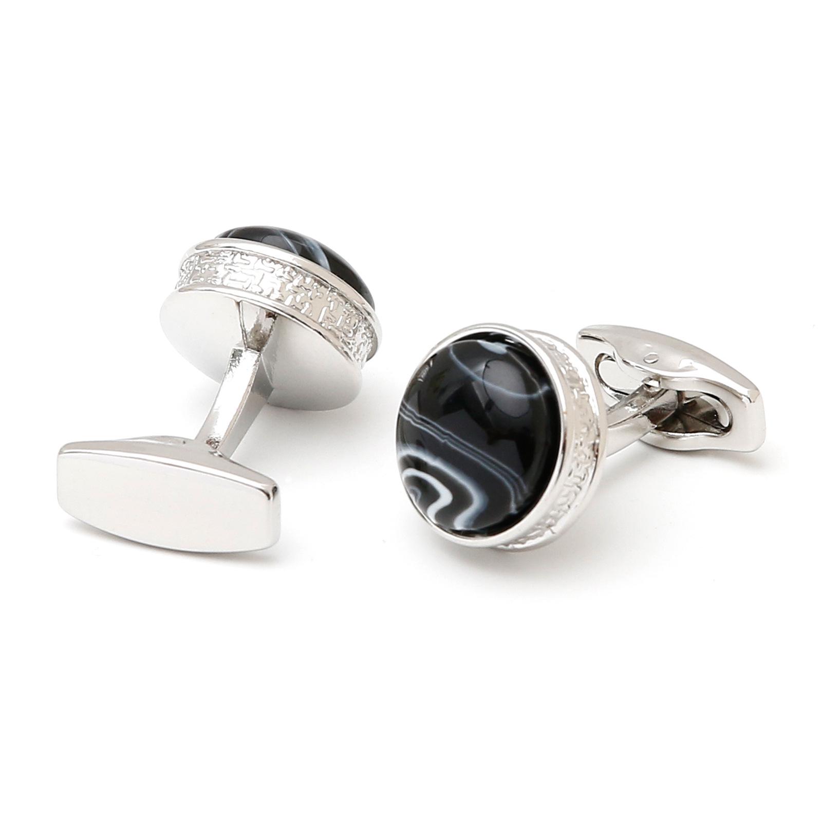 

Мужские круглые серебристые запонки с инкрустацией синим камнем Manual