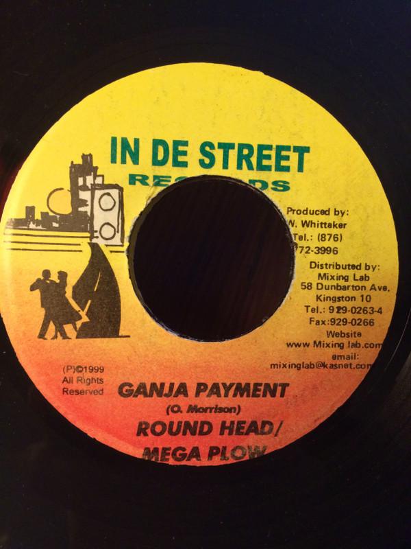 

7-дюймовая пластинка КРУГЛАЯ ГОЛОВКА И МЕГА ПЛУГ - Оплата ганджой НЕТ На Улице Re 1999 Ямайка Регги, Ска и Даб Б/У