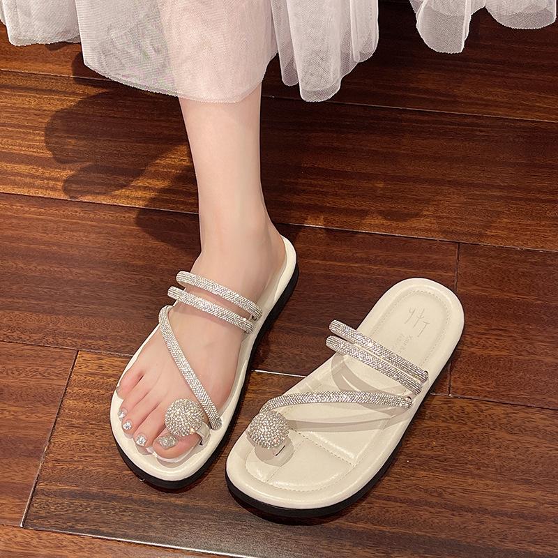 Flat-bottomed cool slippers women's summer wear 2025 new rhinestone fairy wind soft bottom non-slip toe beach one-word drag
