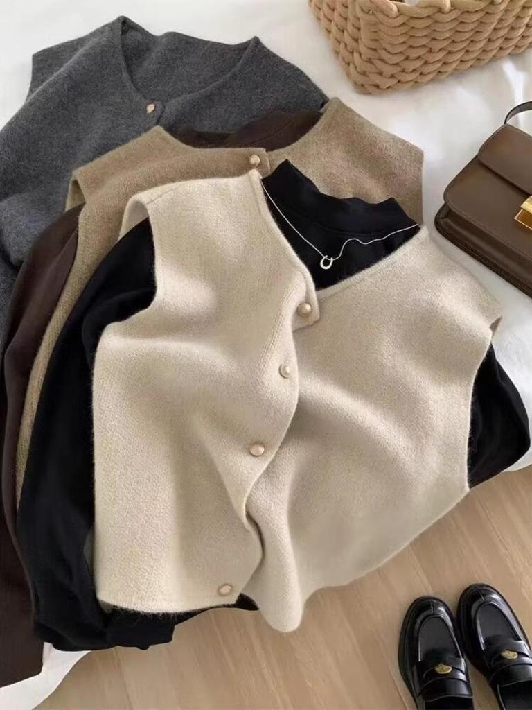 High-End Knit Vest: Women's Korean Style Sleeveless Top with Metal Buttons and Soft Shoulder Pads for Spring and Autumn.