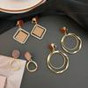 Minimalist Ear Clips: No Piercing, Slimming Circle Earrings for Women.