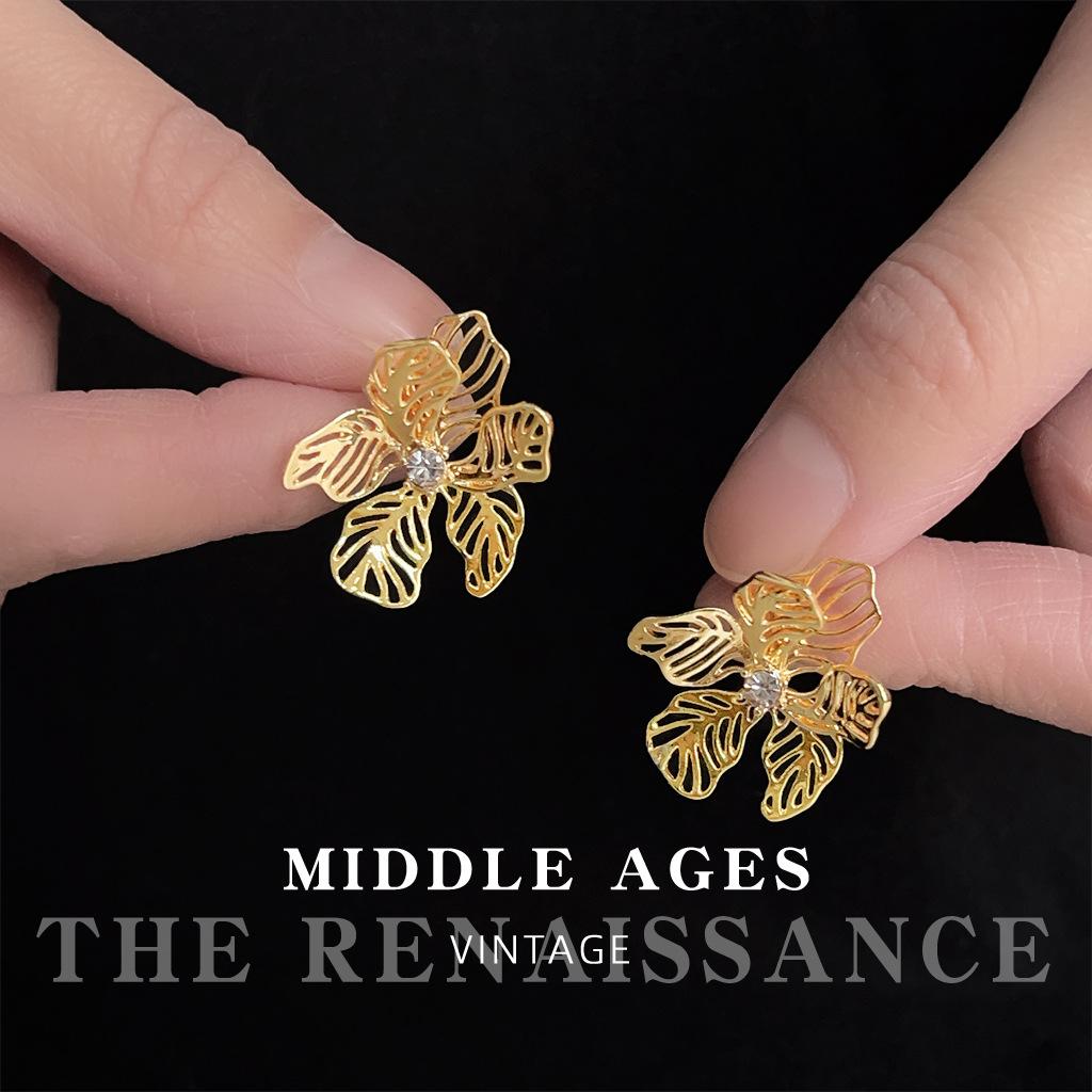Wind hollow flower zircon earrings design sense stud earrings retro literary ear jewelry