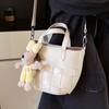 Spring and summer casual simple small fresh personalized woven design sense portable bucket bag fashionable versatile commuter messenger bag