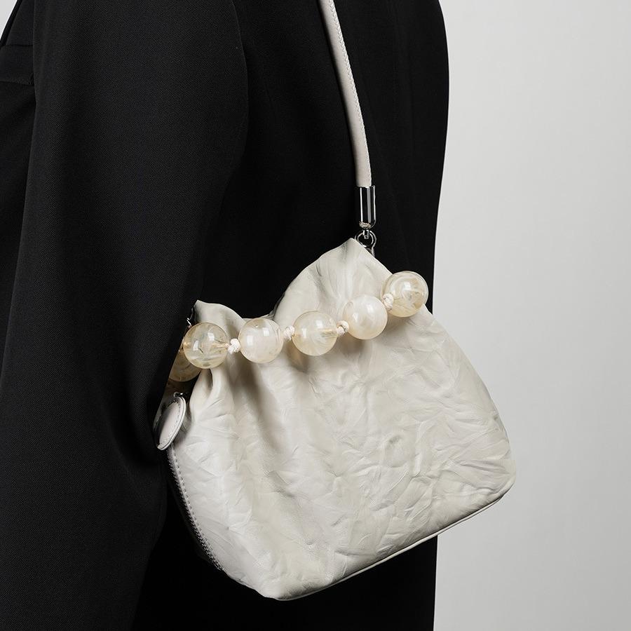 Kopfschichtige Damentasche aus echtem Leder mit Perlen-Tragetasche, neue Perlentasche im chinesischen Stil, Lunchbox-Tasche mit speziellem Handgriffmuster