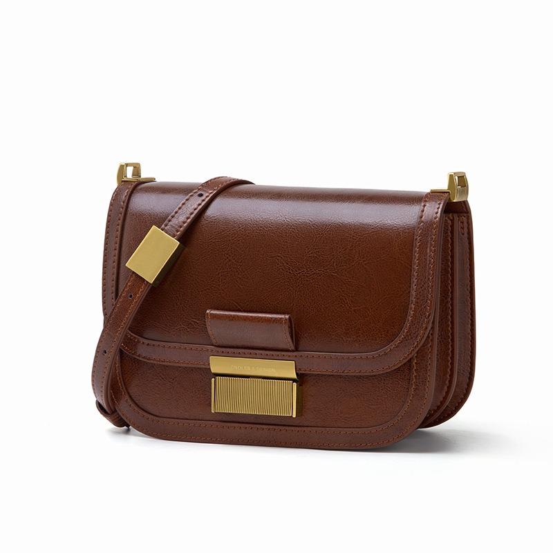 Light luxury premium shoulder messenger bag niche design semi-round bag first layer cowhide saddle bag generation