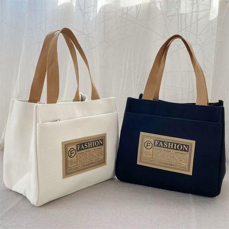 High-value canvas handbag, simple and portable for office workers, casual handbag, lunch box, and handbag.