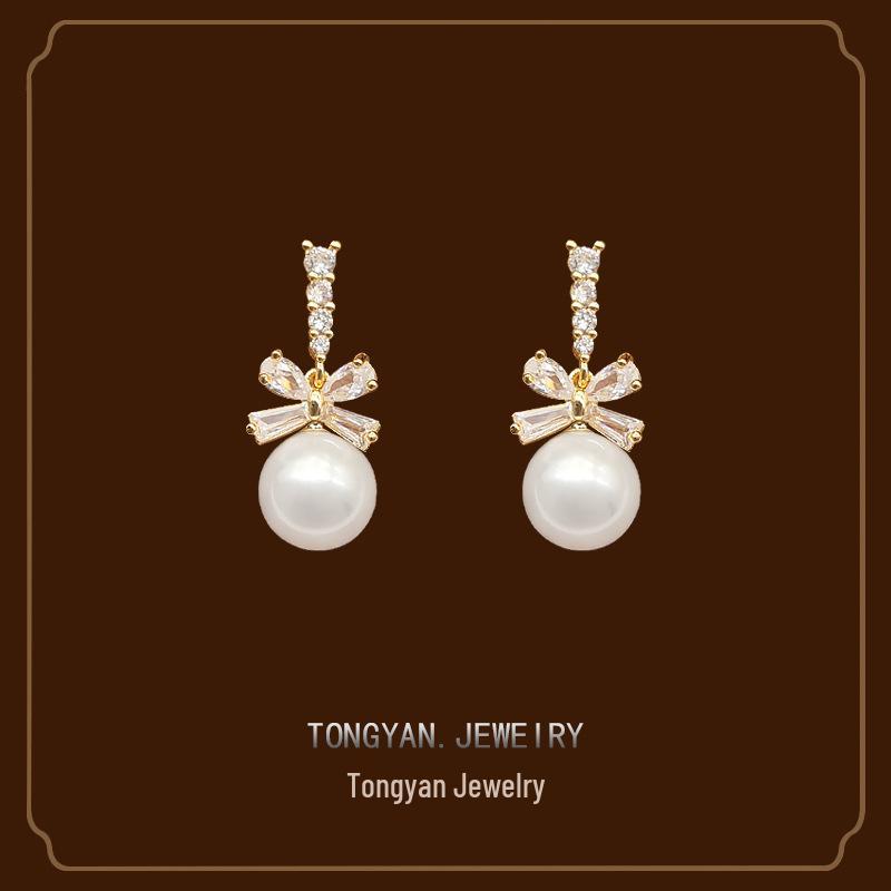 

Elegant Bow Pearl Clip-on Earrings 2024: Stylish Dangle for Non-pierced Ears золотой