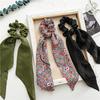 Long flowing ribbon large braided hair accessory for women - ponytail bun hair band with floral design, simple and elegant.