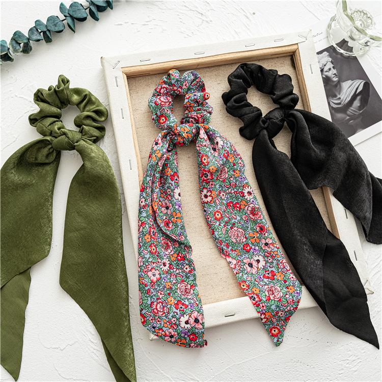 Long flowing ribbon large braided hair accessory for women - ponytail bun hair band with floral design, simple and elegant.