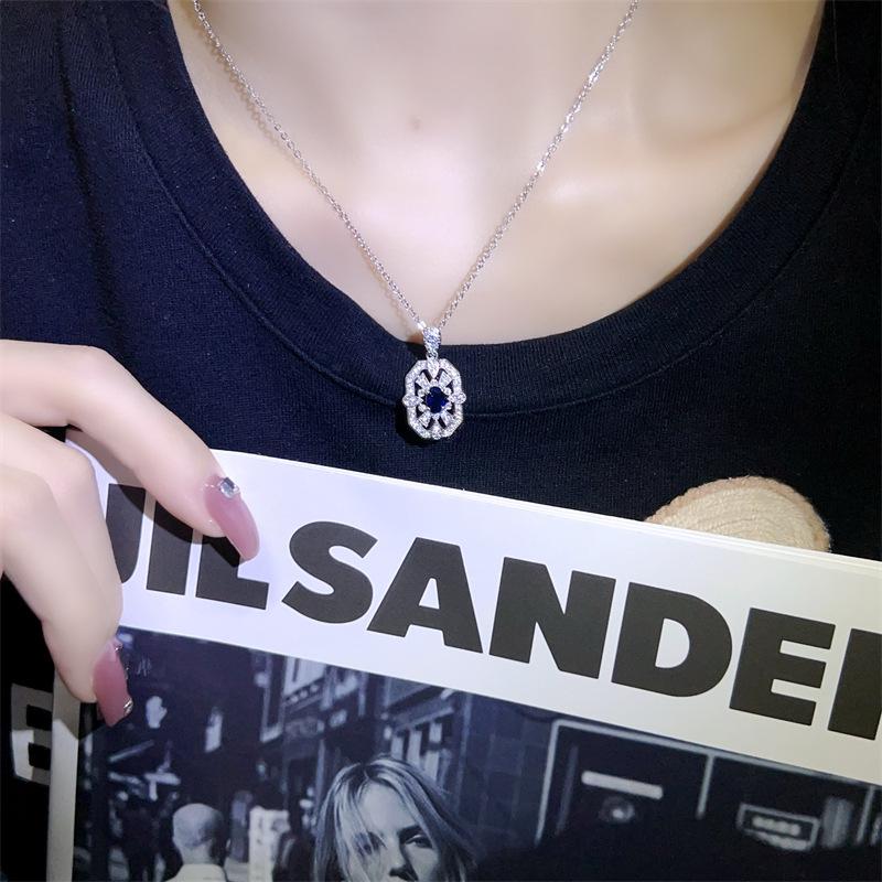Exquisite Aquamarine Zirconia Pendant Necklace - Elegant Hollow Design, Fashionable Clavicle Chain, Versatile Luxury Jewelry for Women.
