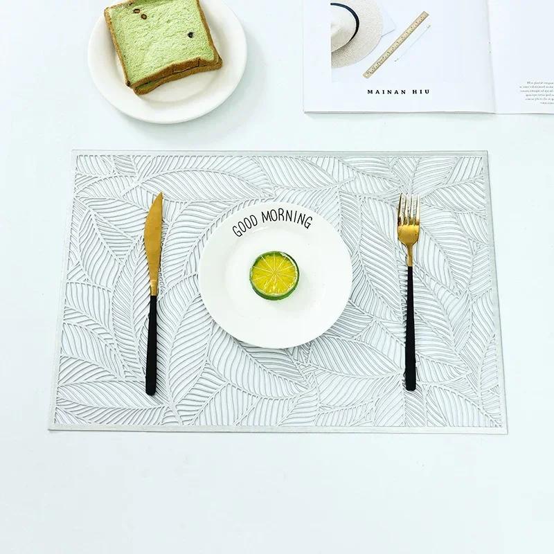 

2025 Light Luxury PVC 45x30cm Meal Mat Leaf Hollow Rectangle Anti-slip Heat Insulation Dinning Table Mat Home Hotel Decoration 45X30CM