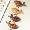 **Cute Koi Fish Carving (Yai Bai Boxwood) - Childlike Handheld Sculpture for Wealth and Fortune**