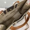 Korean-Style Striped Canvas Shoulder Bag: Women's Minimalist Professional Handbag with Large Capacity.