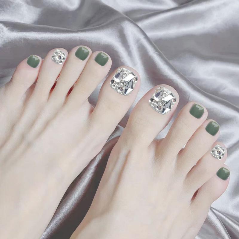

Short Avocado Green Sparkle Toenail Tips with Crushed Diamond Design