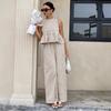 Completo da donna con crop top senza maniche a quadretti Vichy e pantaloni a gamba larga