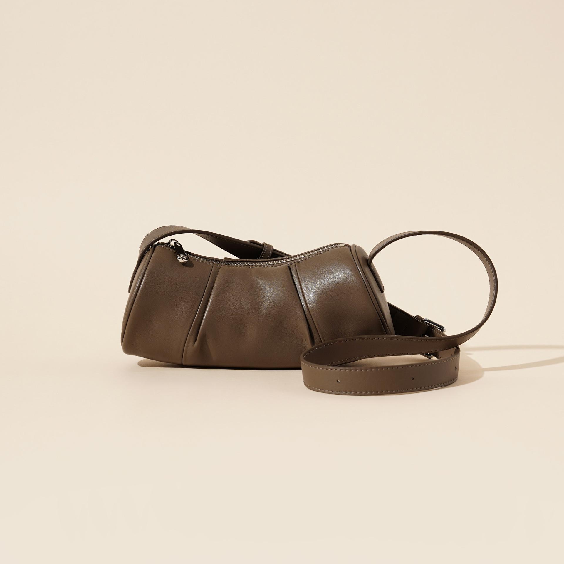 

Кожаная женская сумка бамбуковая сумка весна и лето новинка 2025 нишевый простой дизайн воловья кожа цилиндр женская сумка подмышку сумка-мессенджер 26*10*14cm темно серый