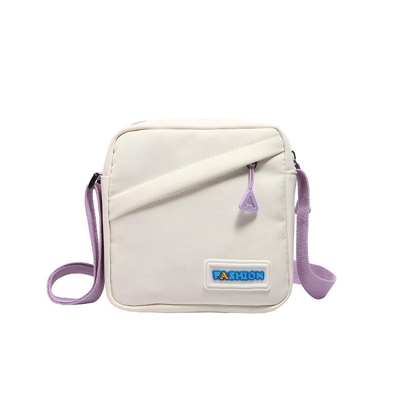 

Korean version of simple casual small square bag 2025 season new girl travel messenger bag student versatile shoulder bag фиолетовый