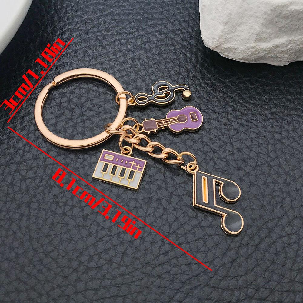 Yellow Oil-Drip Music Earphone & Keyboard Keychain: Creative Backpack Ornament for Men and Women
