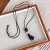 Chinese Vintage Charm: Brown Wooden Pendant Necklace for Women – High-End, Niche Clavicle Chain, Long Summer Style