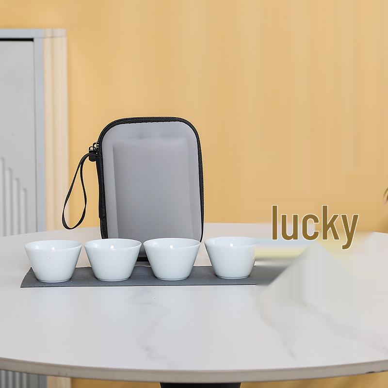 

Compact Travel Tea Set: Outdoor Quick-Brew Pot with 4 Cups, Ideal for Camping with Tea and Water Separation Feature.