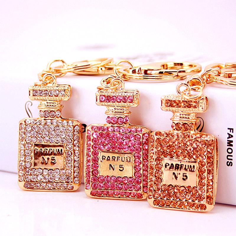 Elegant Diamond-Studded Four-Leaf Clover Keychain: Perfume Bottle Bag Charm for Women