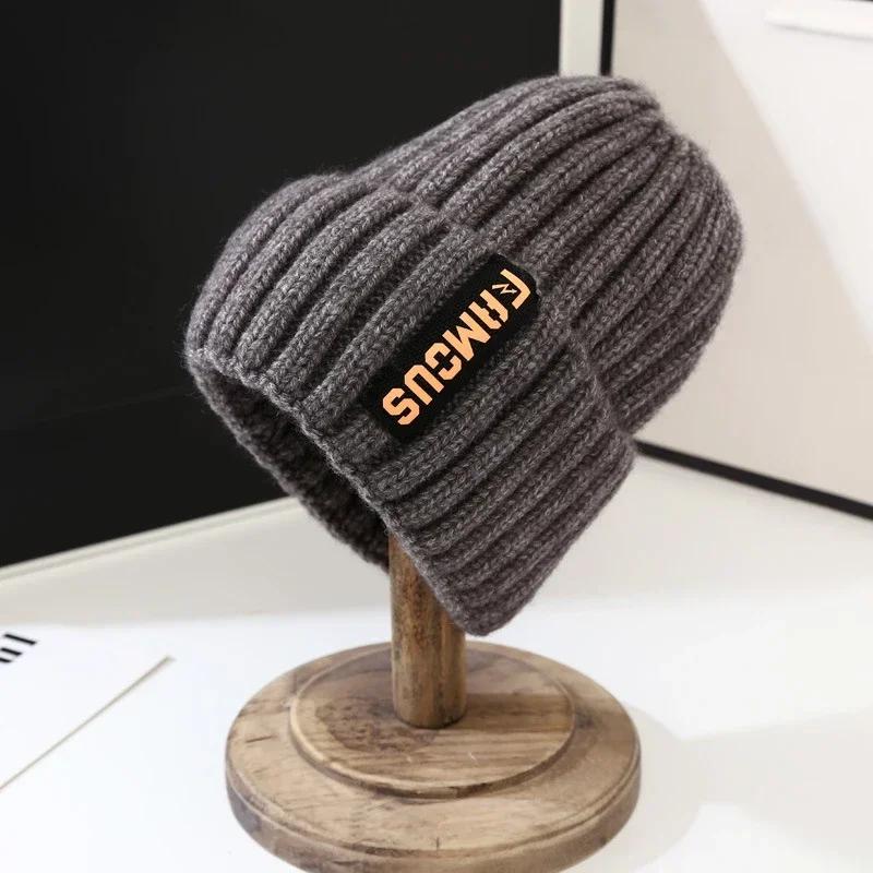 

Simple letter woolen hat for men and women, fashionable and versatile knitted hat, long label, warm cycling, windproof and ear p One Size темно серый