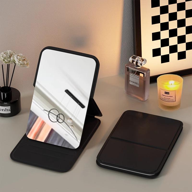 Compact Folding Travel Makeup Mirror - Portable, Handheld & Perfect for Student Dorms or Pocket Use.