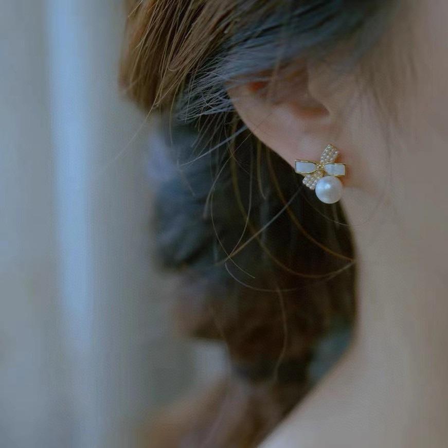 Korean sweet natural freshwater pearl stud earrings ins temperament 911 silver needle bow earrings women's high sense