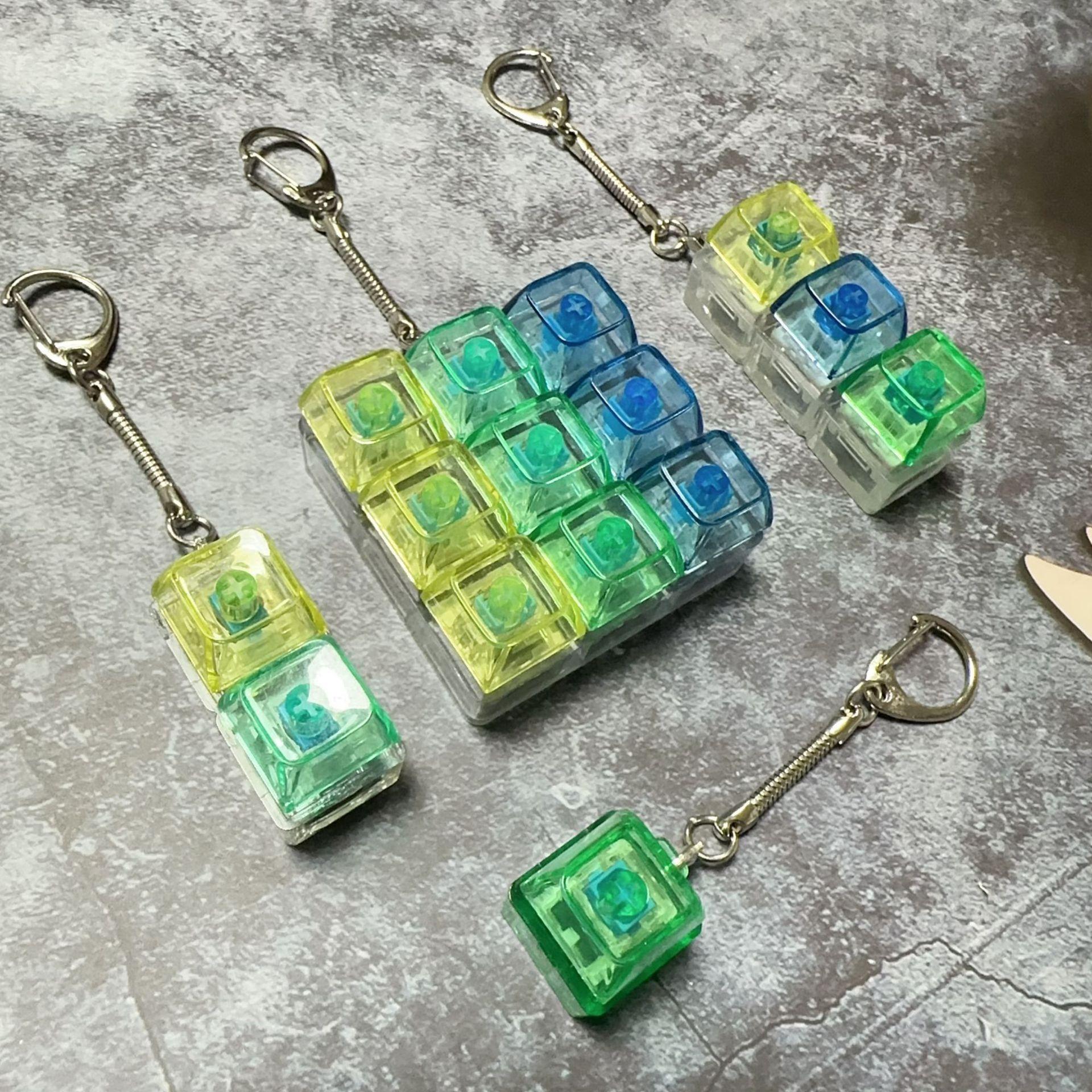 Unzip The Mechanical Keyboard With Light, Press The Keychain, And The Personalized Fully Transparent Light Unzips The Toy Schoolbag Keychain.