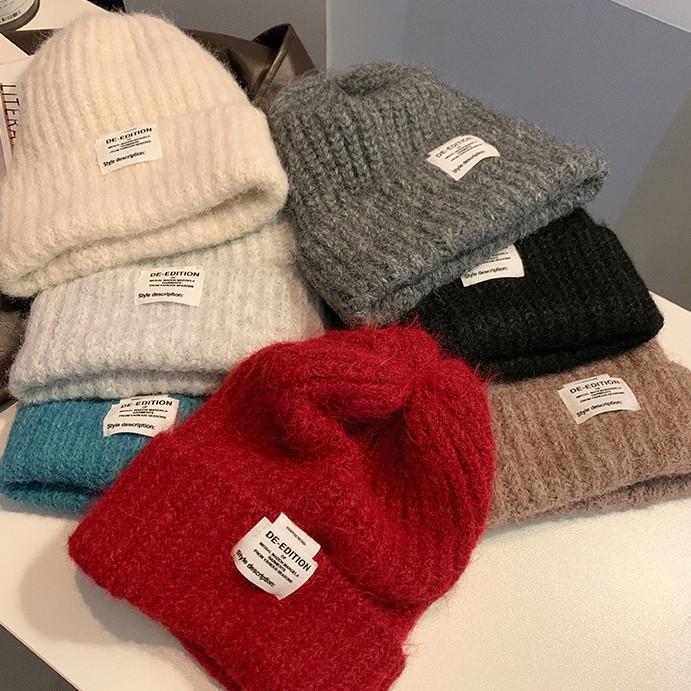 Chapeau de laine coréen doux et mignon à grosse tête Automne et hiver Décontracté Polyvalent Chapeau de tête Coupe-vent Oreilles chaudes Chapeau tricoté