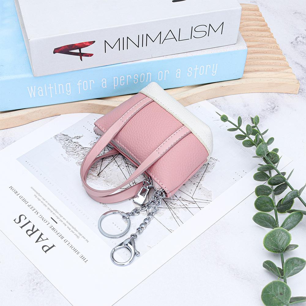 

Leather mini portable change bag women s new fashion compact garden bag first layer cowhide coin lipstick key bag рожевий