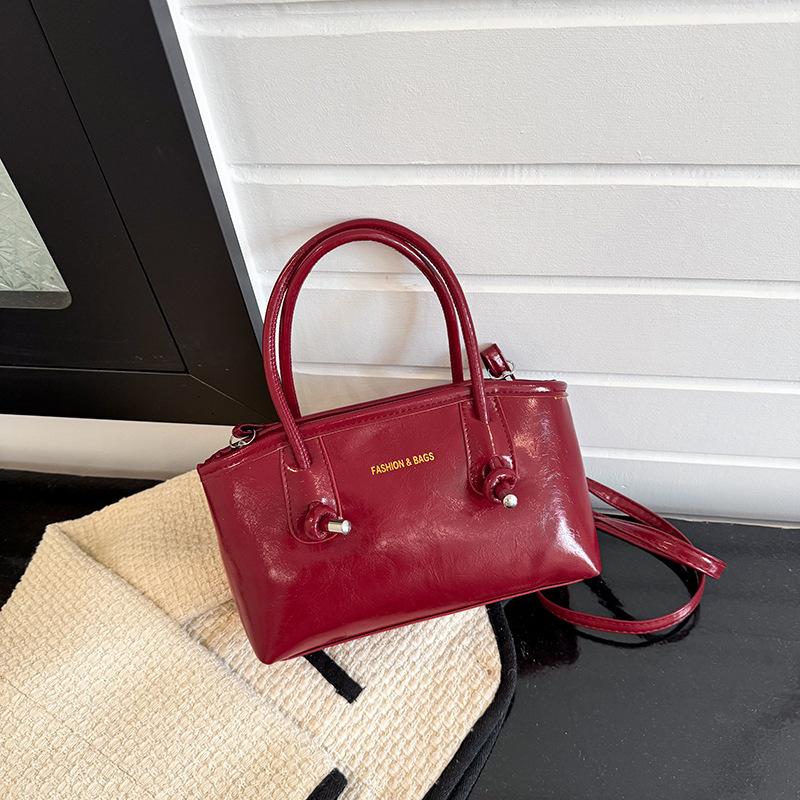 

Senyang air support bag women s 2025 new French niche commuter bag Korean version large-capacity shoulder messenger bag червоний