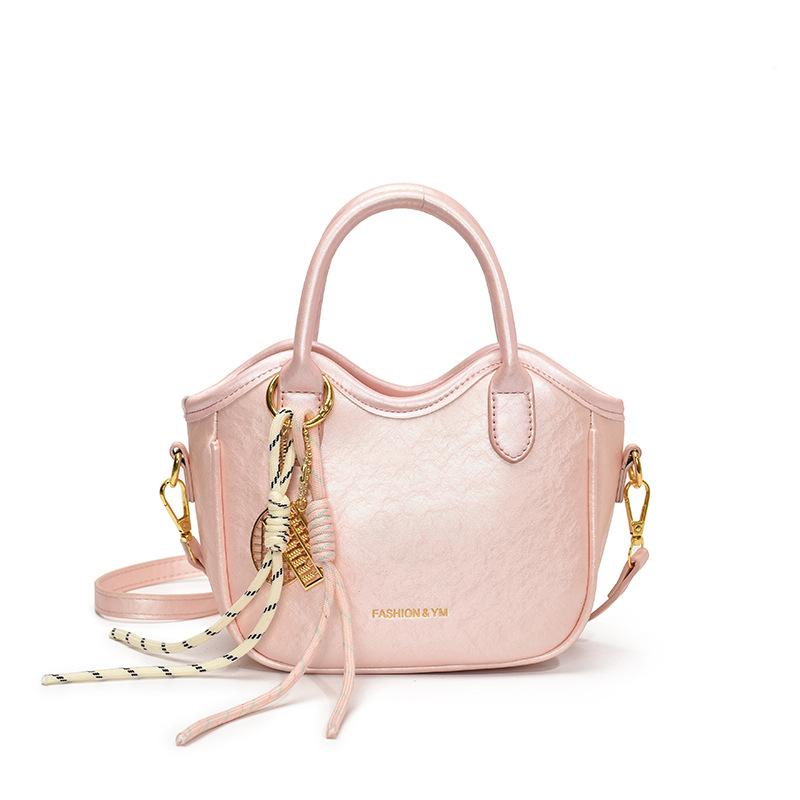 

Spring and summer popular Korean version of high-value commuter hand-carried bucket bag women s casual versatile foreign style niche design messenger розовый