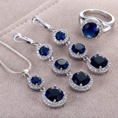 Набір прикрас з блакитного та червоного циркону: Кільце, Сережки, Кольє, Підвіска - Жіноча колекція з 4 предметів