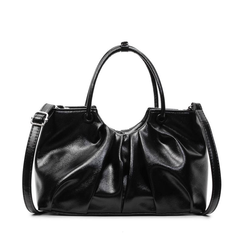 Korean version of foreign style niche design pleated handbag bag women's versatile foreign style advanced sense oil wax leather commuter messenger bag